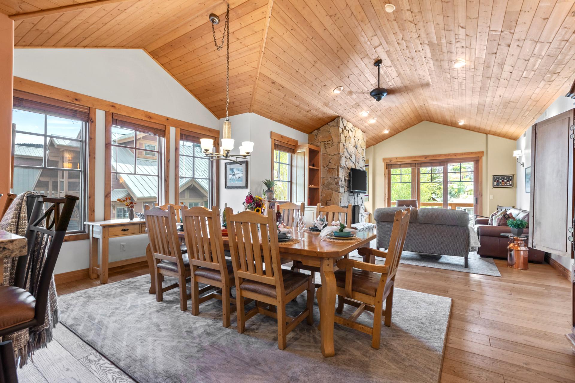 This dining view shows great natural light and seamless flow into the kitchen and balcony.