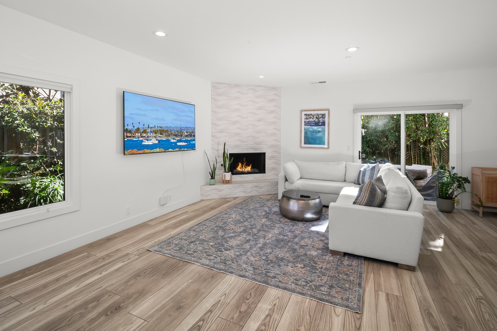 Stretch out on the sectional while the open layout keeps conversation flowing easily between living, dining, and kitchen spaces.