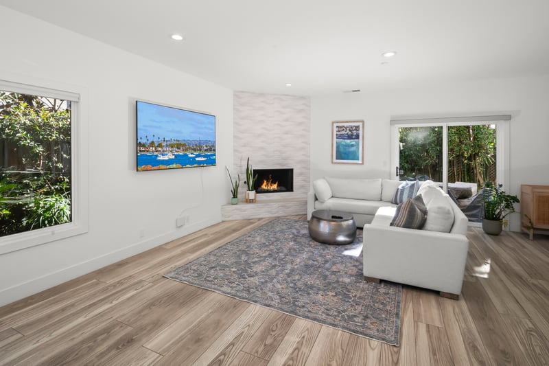 Stretch out on the sectional while the open layout keeps conversation flowing easily between living, dining, and kitchen spaces.