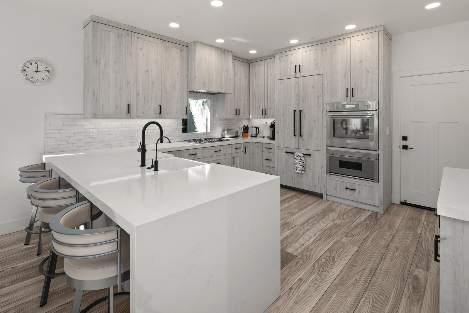 Your modern kitchen keeps everything within reach, with bright counters and seating that naturally becomes a gathering spot.