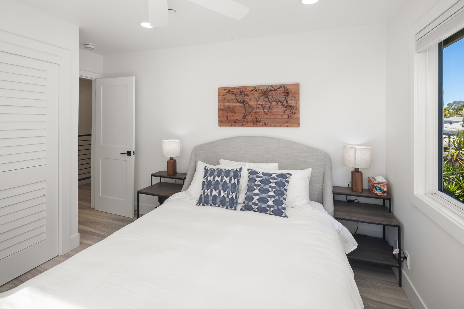 Settle into this inviting bedroom after exploring Encinitas, where simple furnishings keep the space calm and restful.