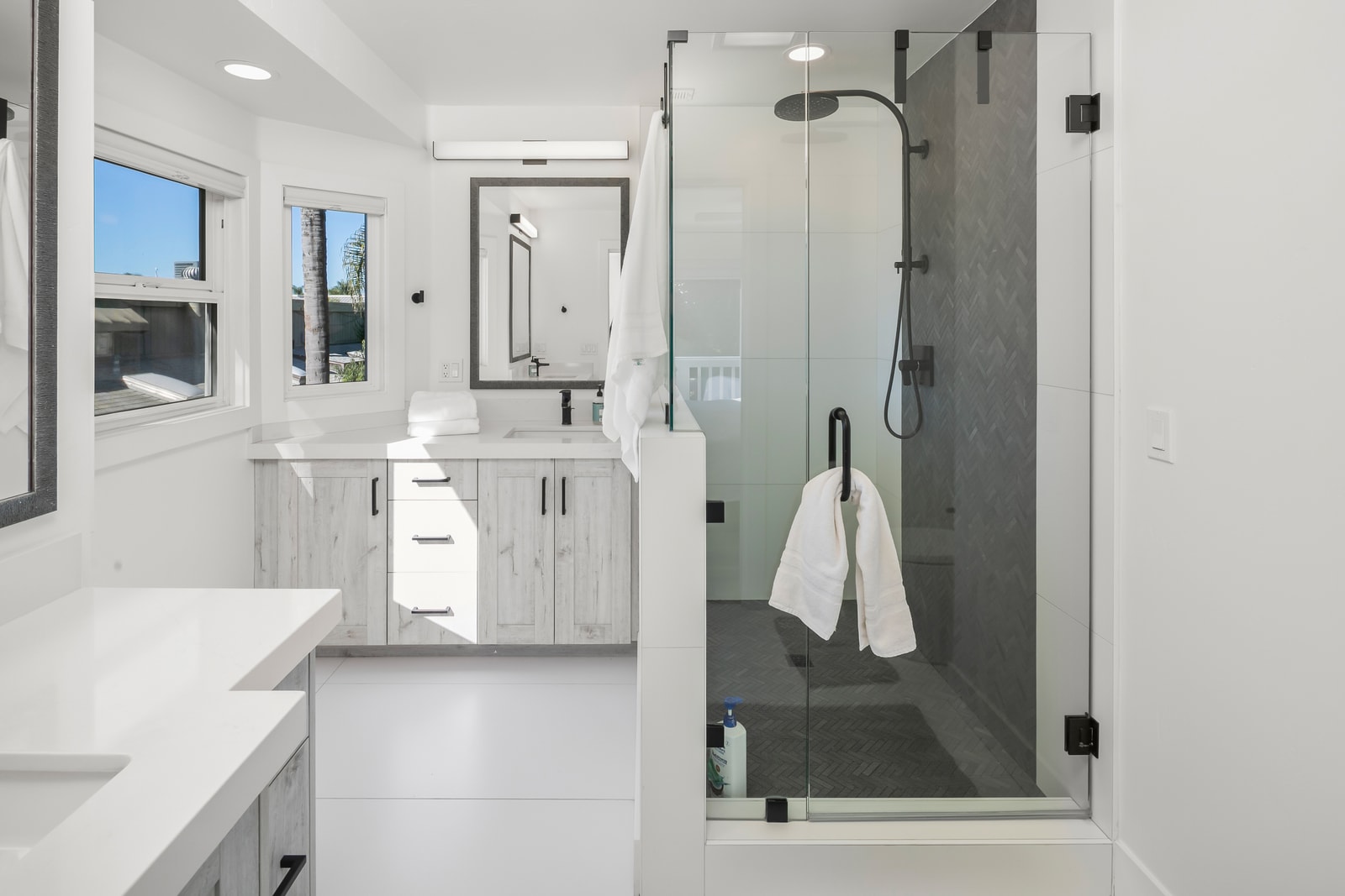 Refresh in your primary bath featuring a glass walk in shower and bright finishes that keep the space feeling open.