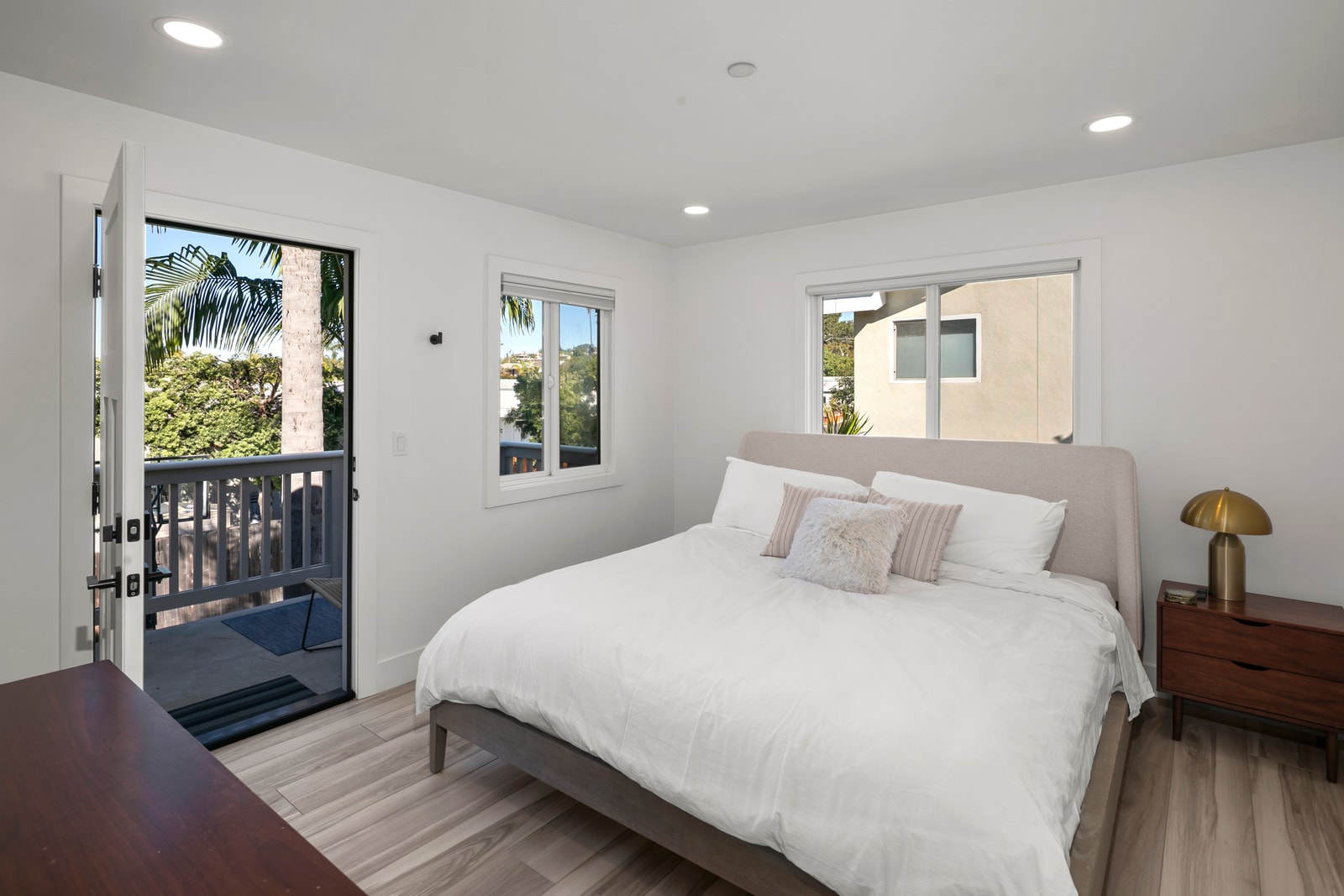 This guest bedroom provides a cozy sleeping space with a comfortable bed and thoughtful furnishings for longer stays.