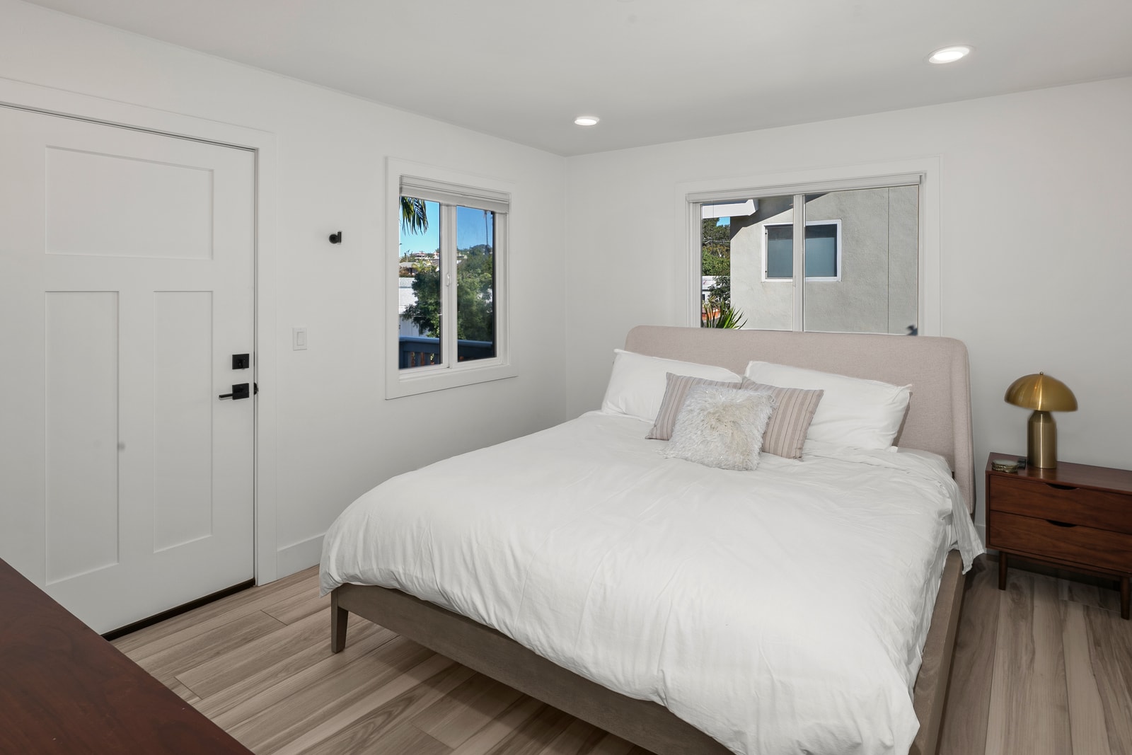 Natural light and neutral tones help this bedroom feel relaxed, making it easy to settle in right away.