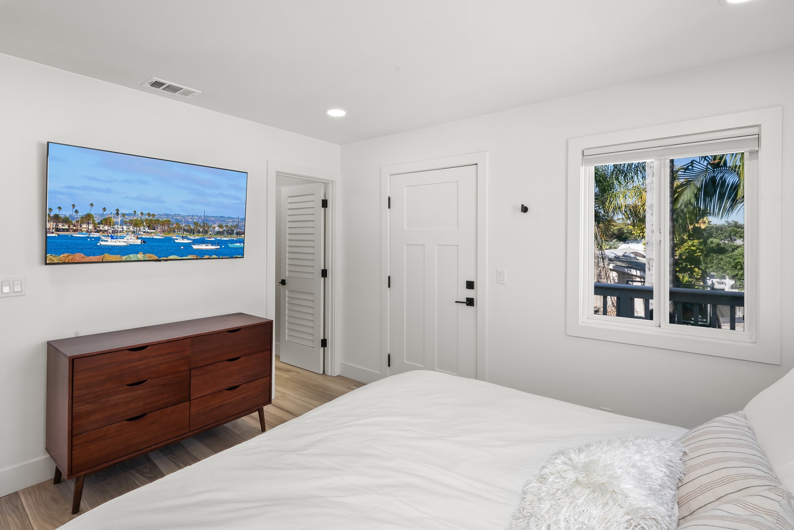 Enjoy a peaceful night’s sleep in this guest room, positioned away from main living areas for added quiet.