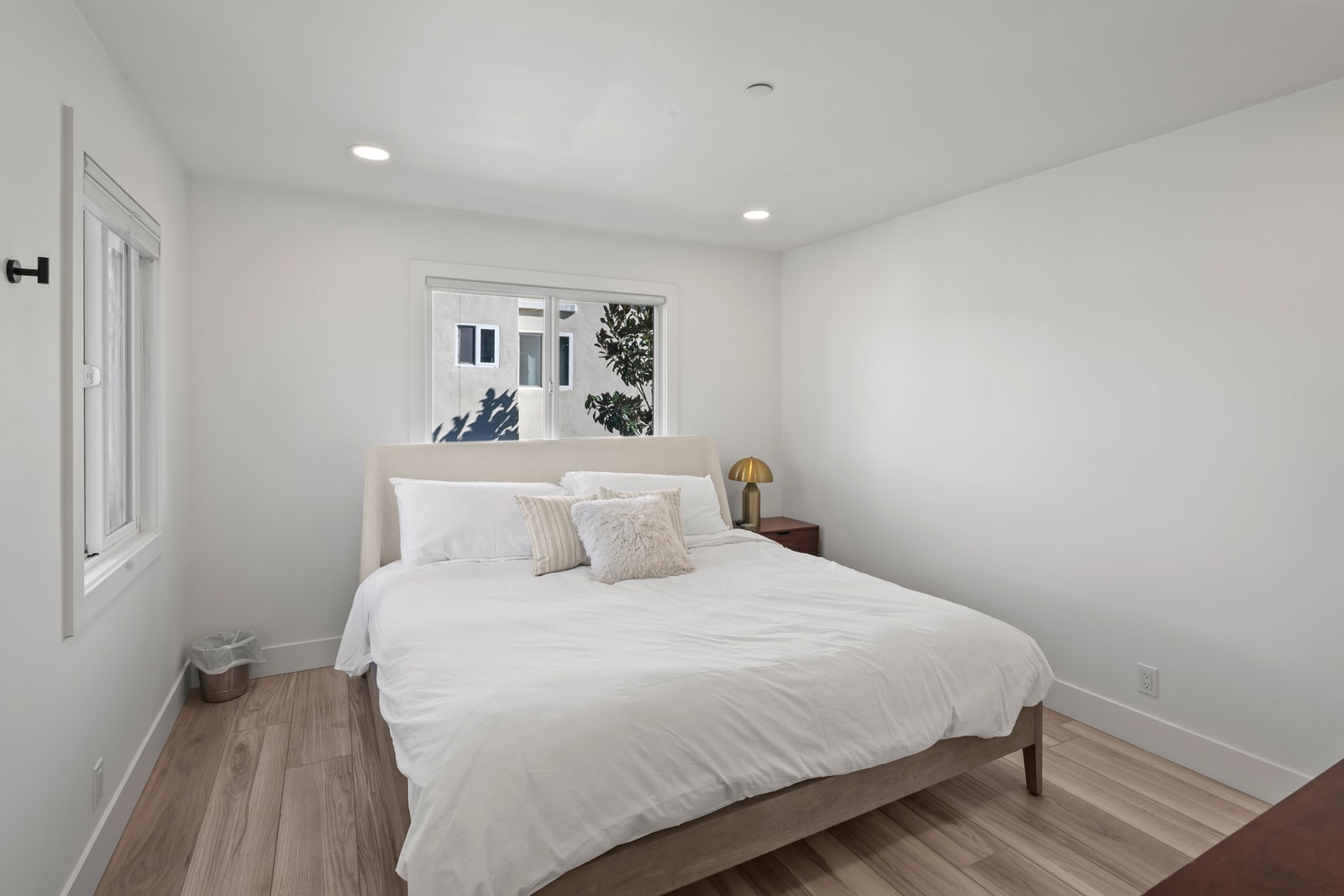 This guest bedroom provides a cozy sleeping space with a comfortable bed and thoughtful furnishings for longer stays.