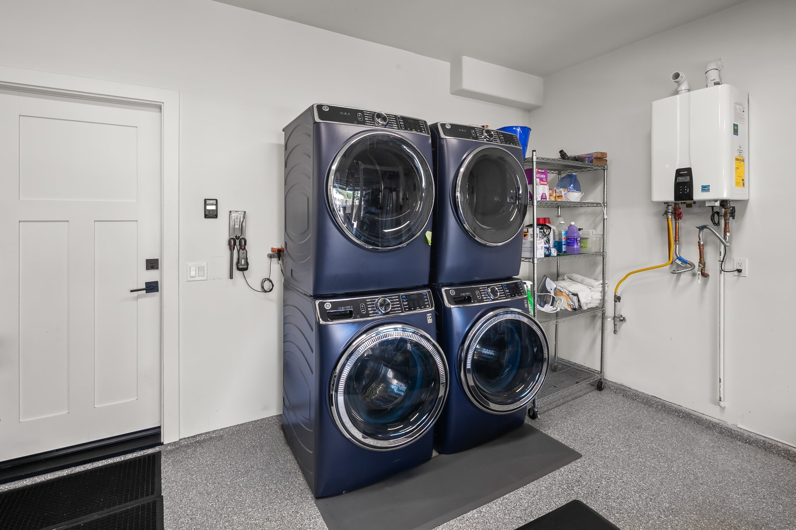 Laundry area includes full size machines and storage, helping you stay organized during longer visits.