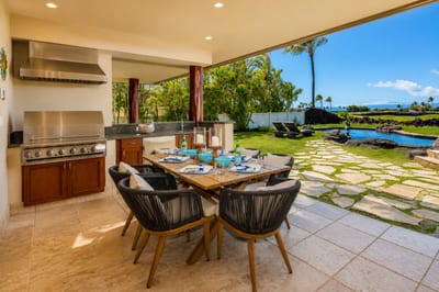 The outdoor dining table and grill are ideal for gathering with loved ones for a meal