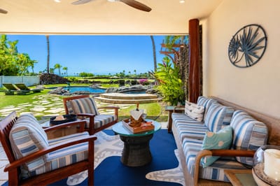 The lanai features comfortable, shaded seating, perfect for relaxing after spending the day by the pool