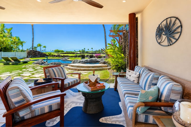 The lanai features comfortable, shaded seating, perfect for relaxing after spending the day by the pool