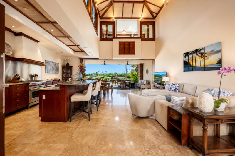 The main living area features high ceilings, wood details, and an open, airy layout