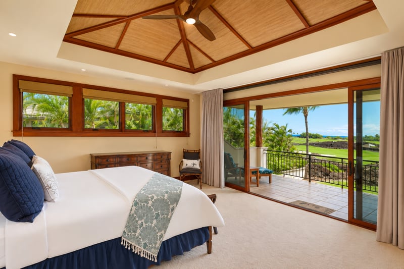 The primary bedroom features a king bed and private lanai