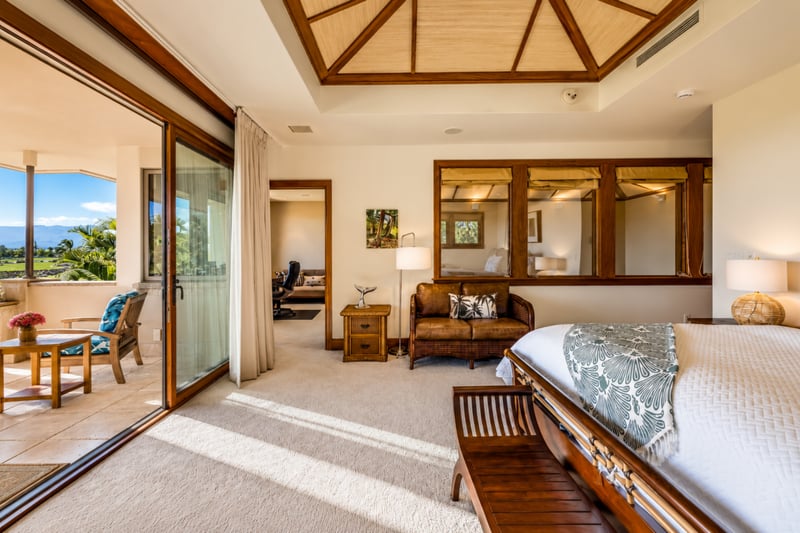 A sitting area within the primary bedroom offers a comfortable spot to start the morning