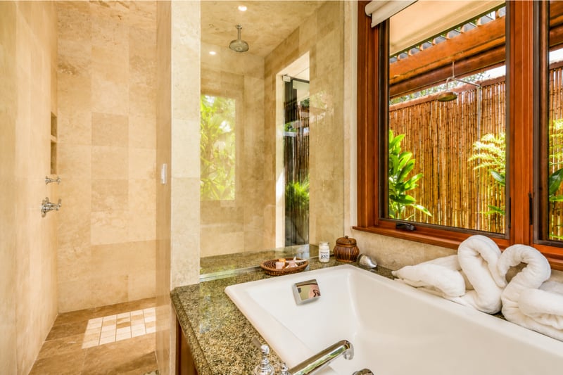 The walk in shower and separate soaking tub turn the bathroom into a spa-like retreat