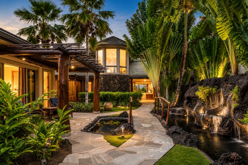 The lush tropical pathway winds through the property