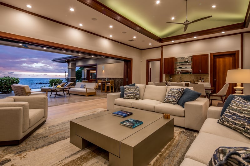 Vaulted ceilings, plush seating, and open sightlines make the living room perfect for group gatherings.