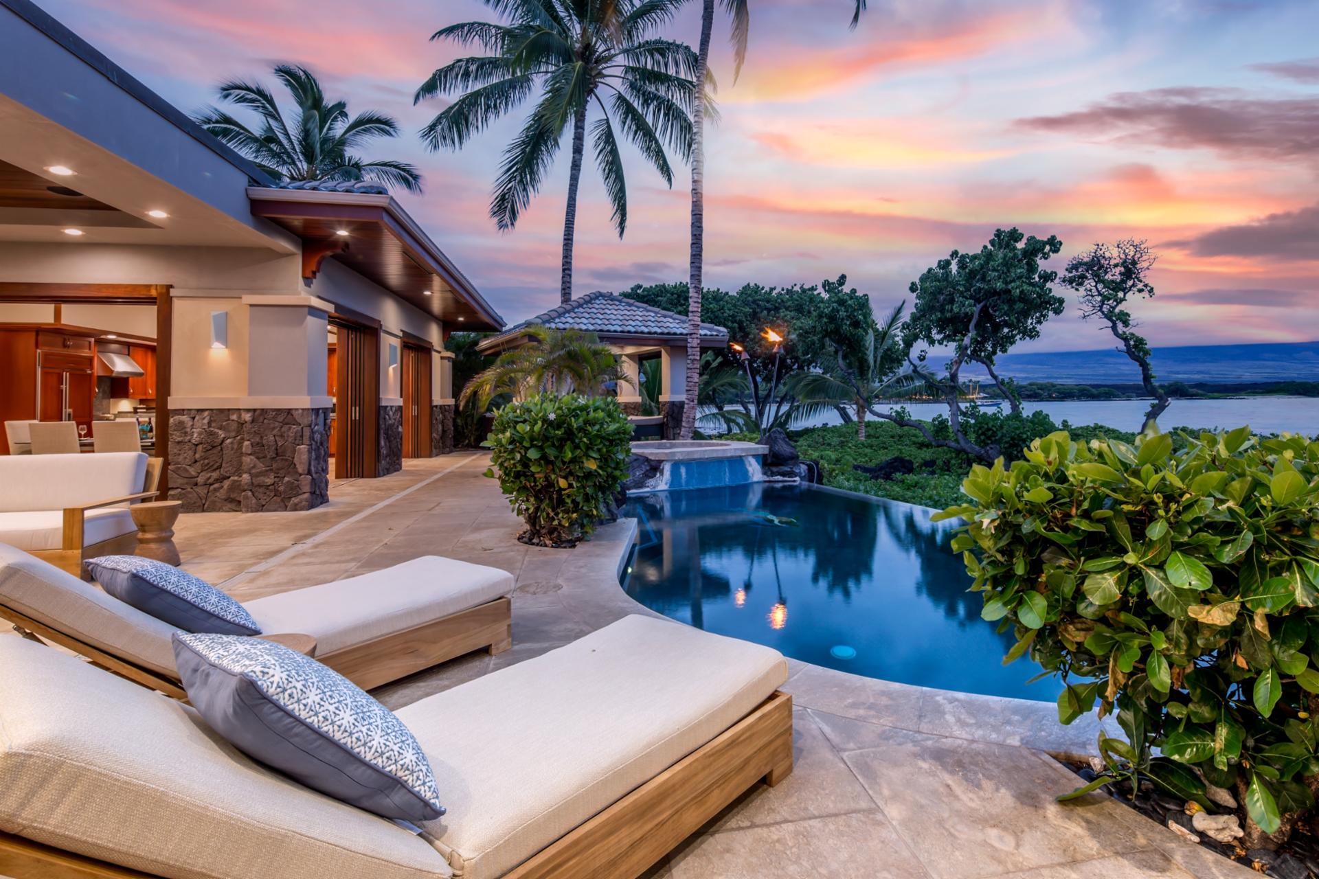 This luxury estate offers seamless access to your pool from both primary suites and main living spaces.