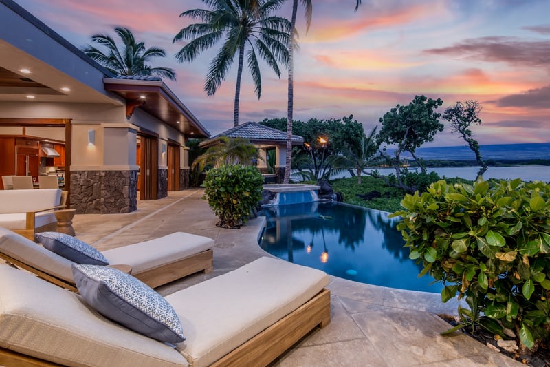 This luxury estate offers seamless access to your pool from both primary suites and main living spaces.