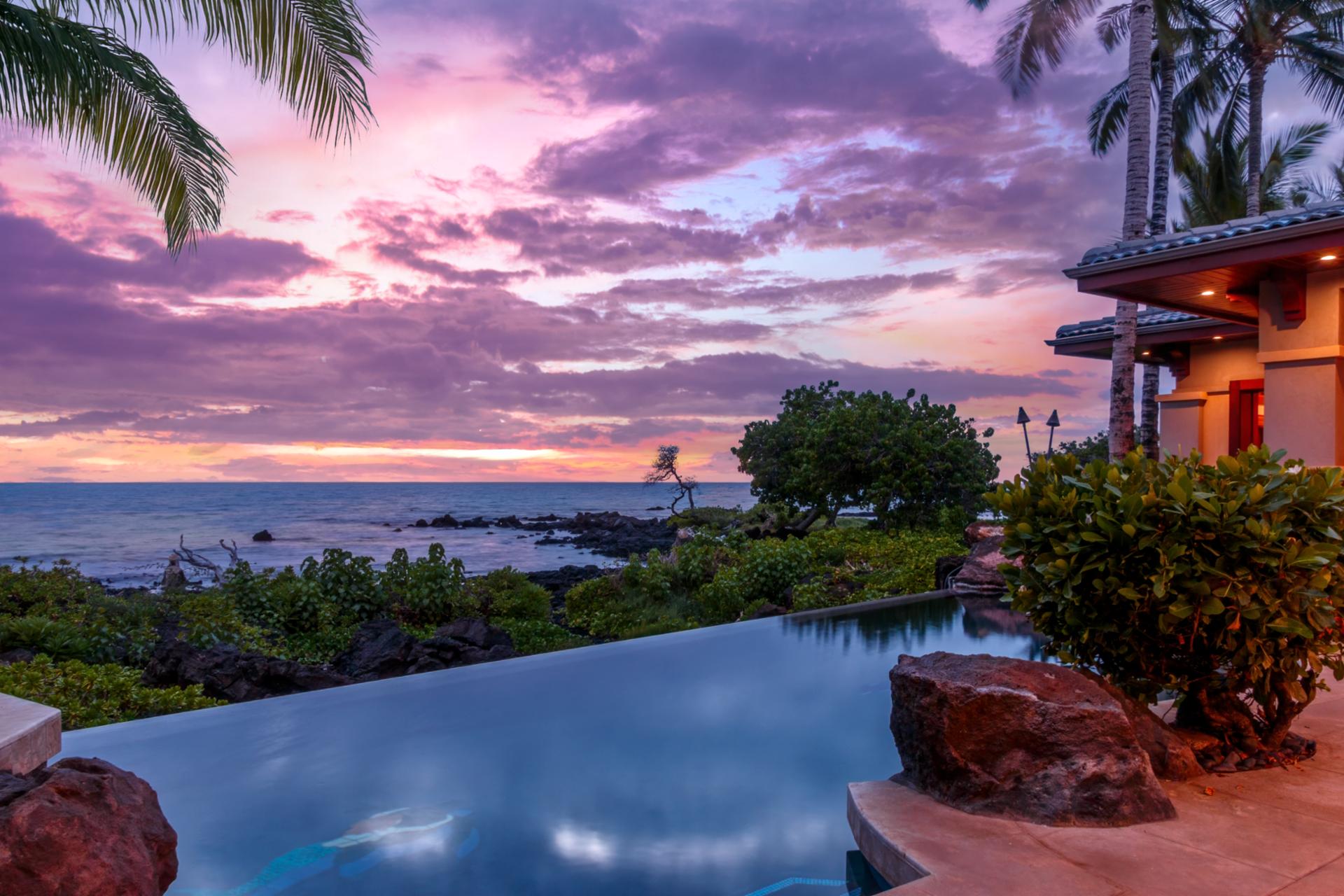 Swim in your private infinity-edge pool overlooking the ocean and surrounded by sunset skies.