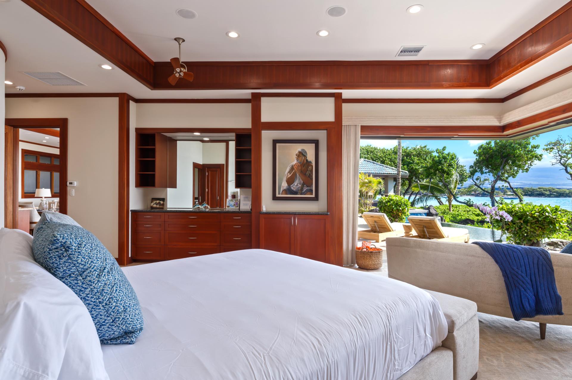 Primary suite includes a King bed, lanai access, and serene design touches.