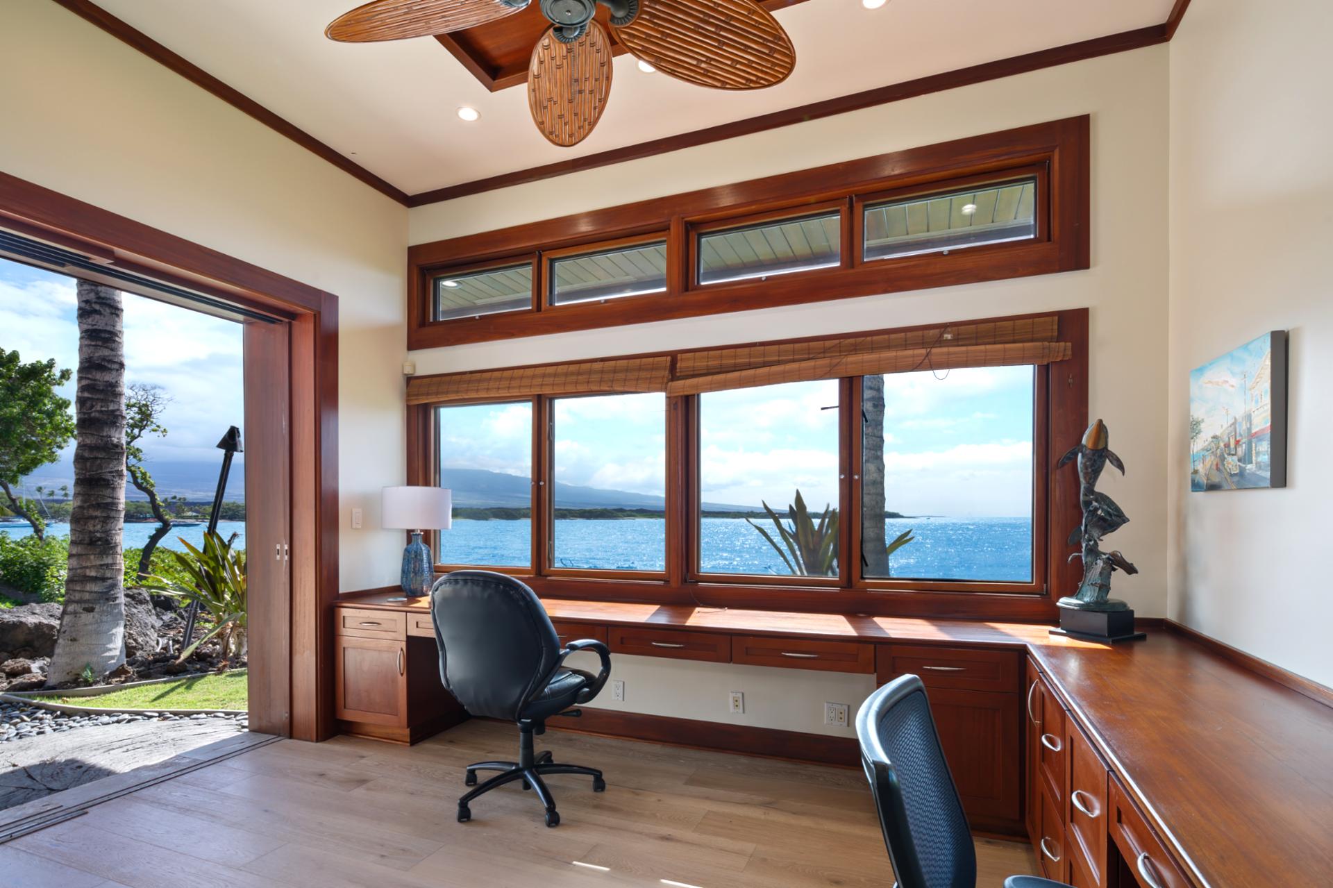 Office or study includes built-in desk, ocean views, and plenty of space for productivity.