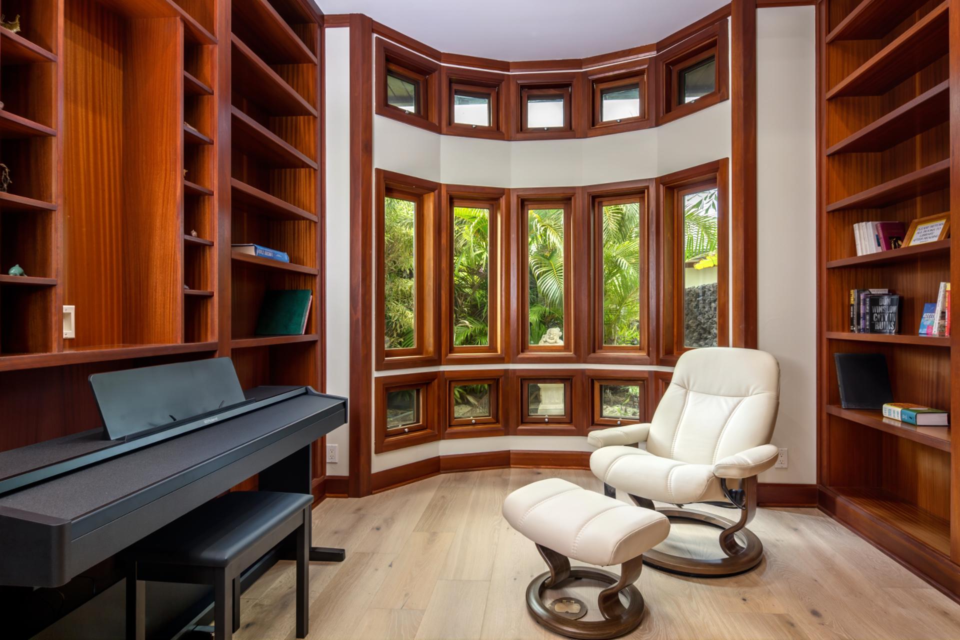 Your entertainment room includes full theater seating, custom walls, and surround sound.