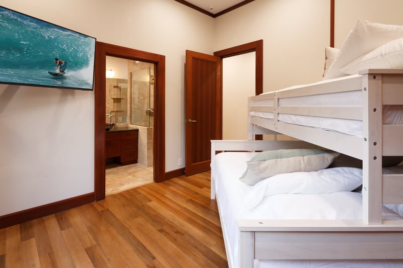 Fourth bedroom sleeps up to five with a Queen bed below and a Twin on top, great for families.