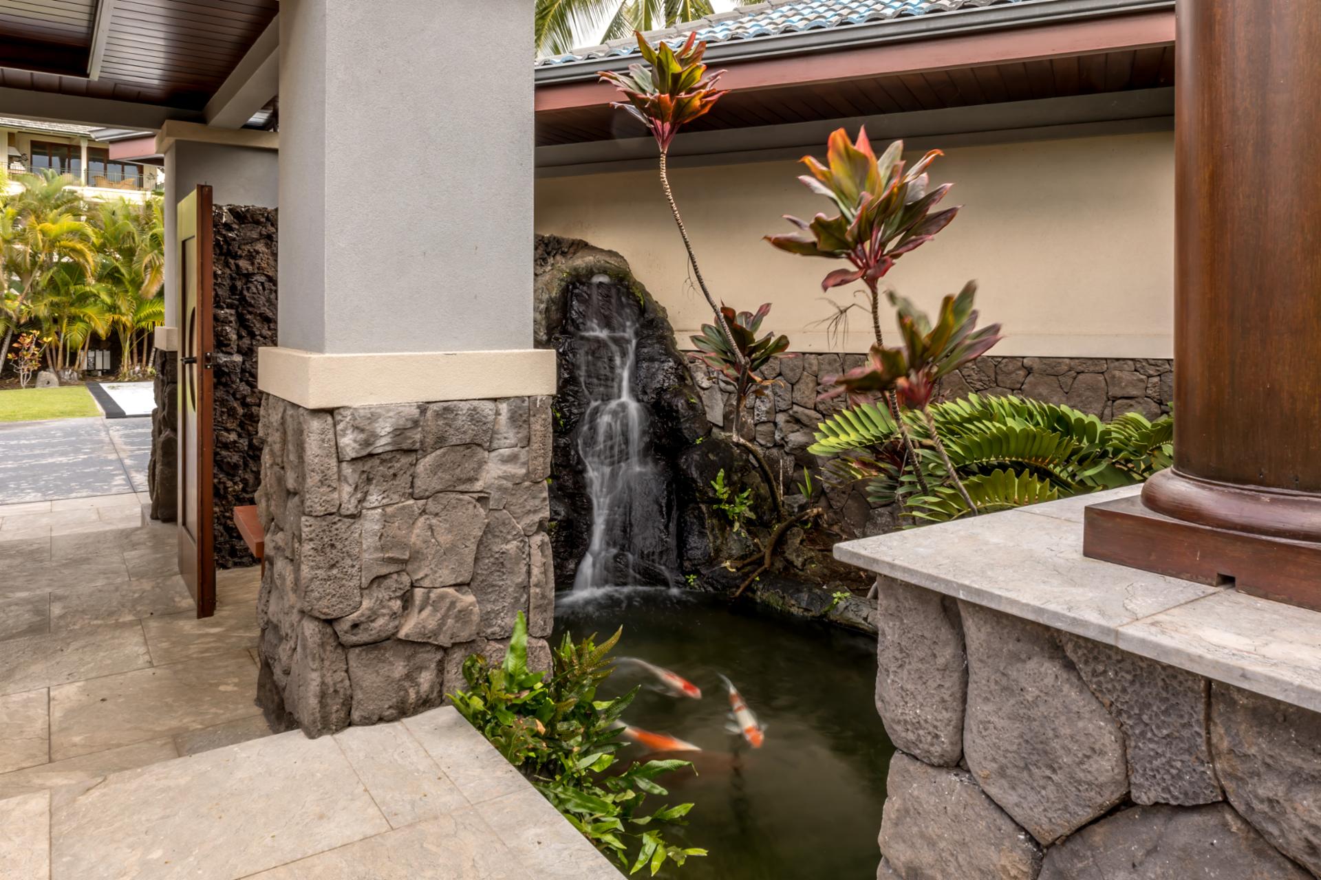 Water features and manicured landscaping create a tranquil welcome.