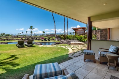 The guest bedroom's lanai opens up to the spacious back yard