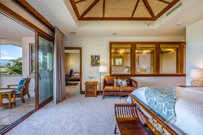 A sitting area within the primary bedroom offers a comfortable spot to start the morning