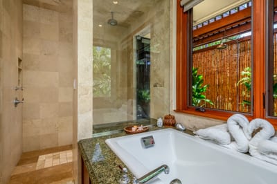 The walk in shower and separate soaking tub turn the bathroom into a spa-like retreat