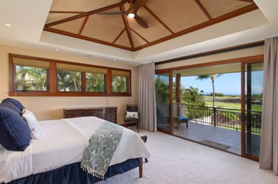 The primary bedroom features a king bed and private lanai