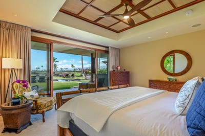 The downstairs bedroom features a king bed and direct access to the lanai and pool