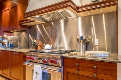 The industrial style gas range features an induction cook top for added convenience while cooking