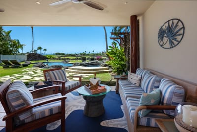 The lanai features comfortable, shaded seating, perfect for relaxing after spending the day by the pool