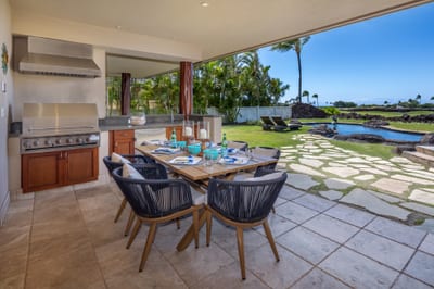 The outdoor dining table and grill are ideal for gathering with loved ones for a meal