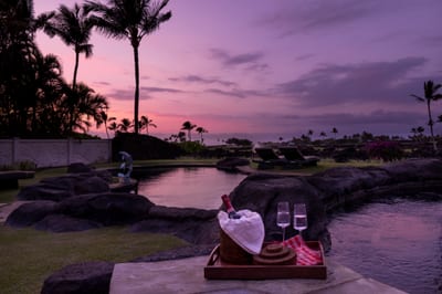 Relax by the pool with a drink and a gorgeous sunset view