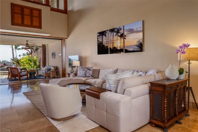 The living area flows toward the lanai with natural light filling the open space