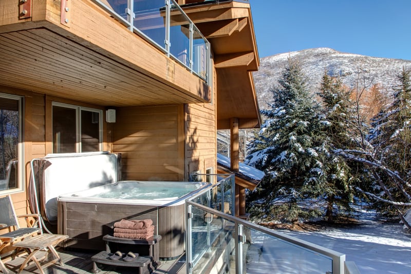 Private deck hot tub - soak in the bubbling spa with panoramic Deer Valley mountain views