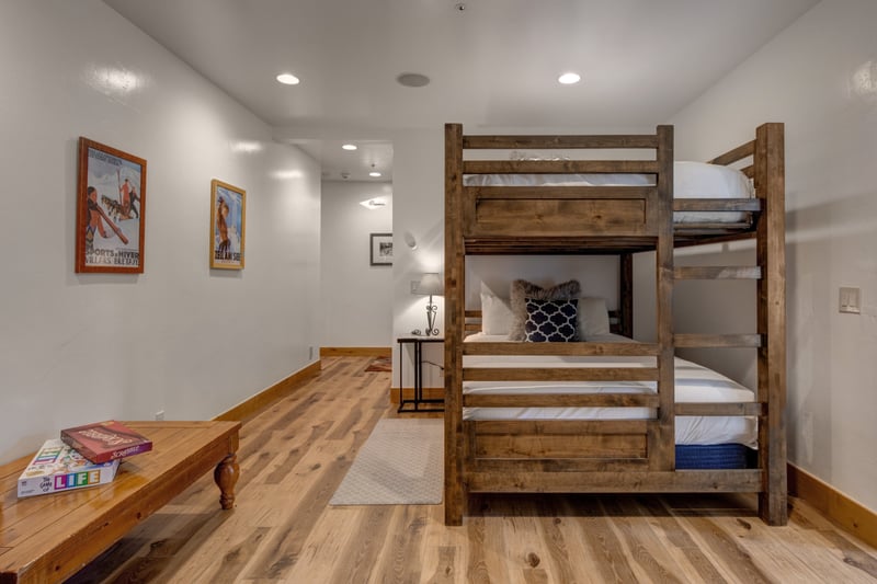 Bunk room with Queen-over-queen bunk bed sleeps extra guests, with board games for family game night