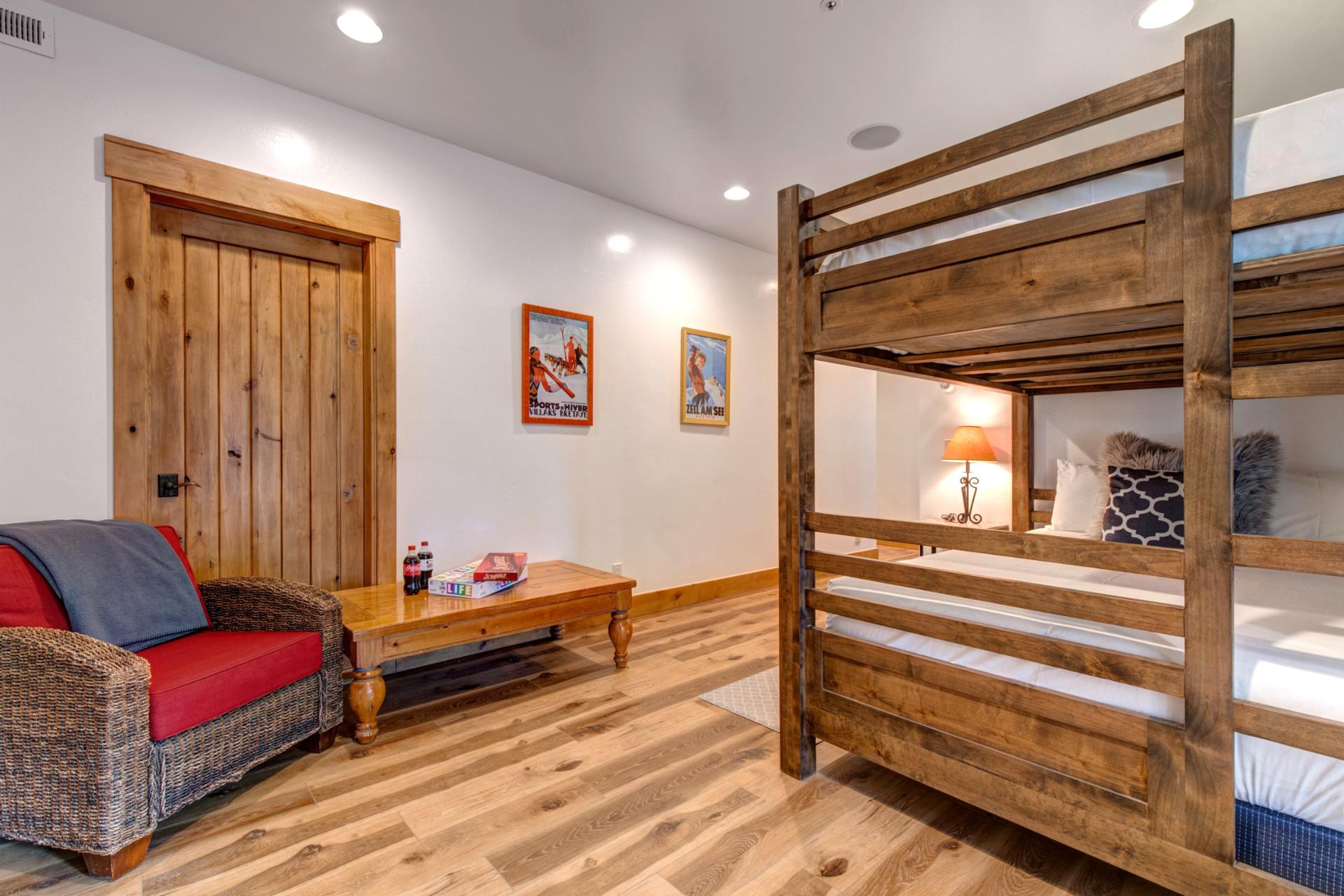 Wooden floors with rustic bunk bed and TV