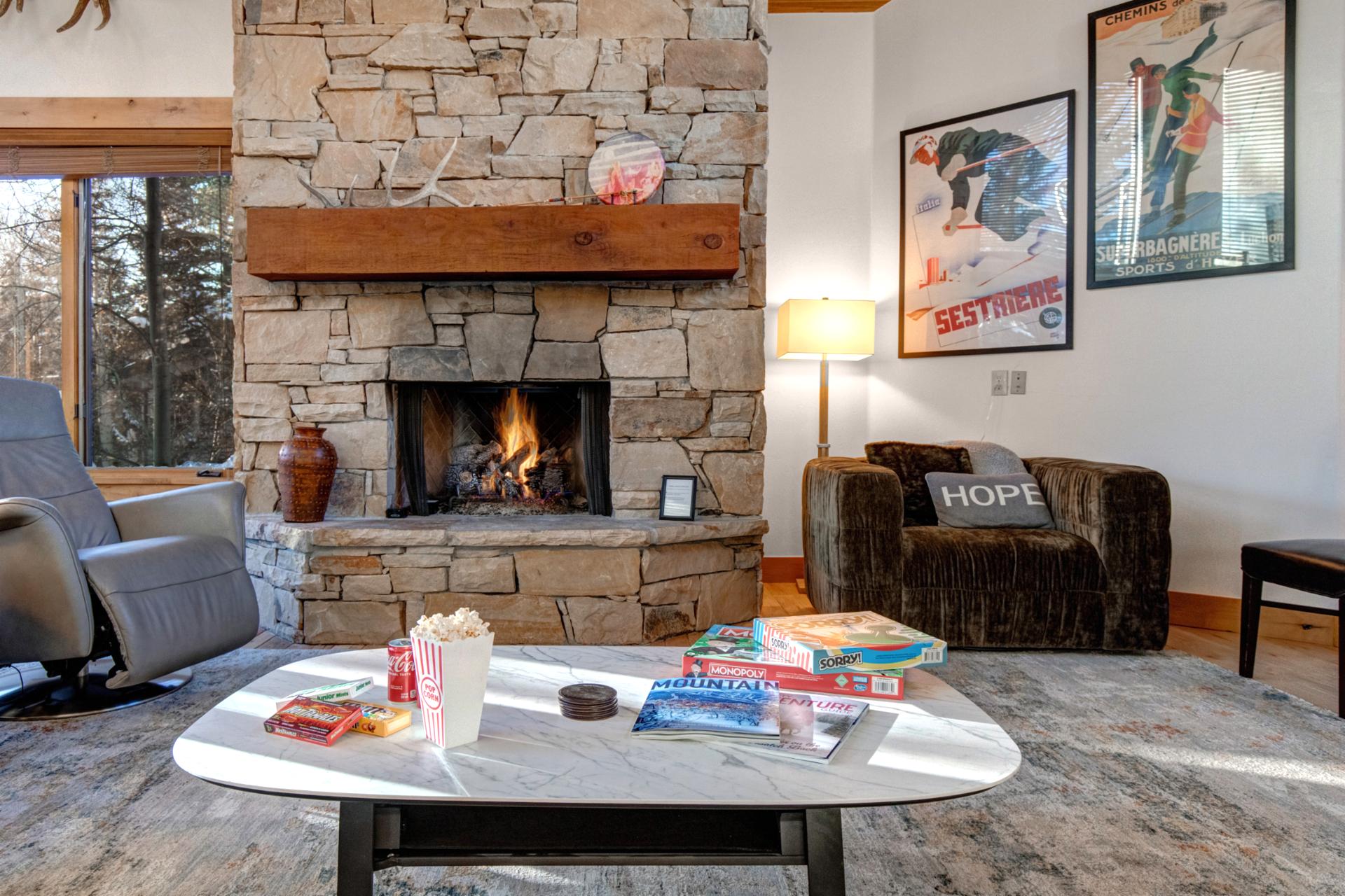 Settle into comfortable seating around the fireplace, a welcoming living room for conversations, reading, or winding down after a full day out.