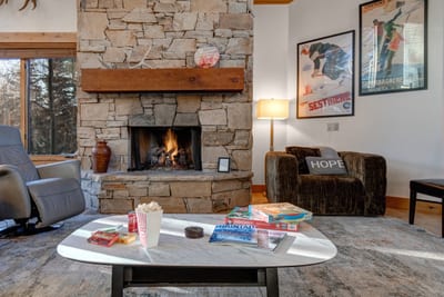 Settle into comfortable seating around the fireplace, a welcoming living room for conversations, reading, or winding down after a full day out.