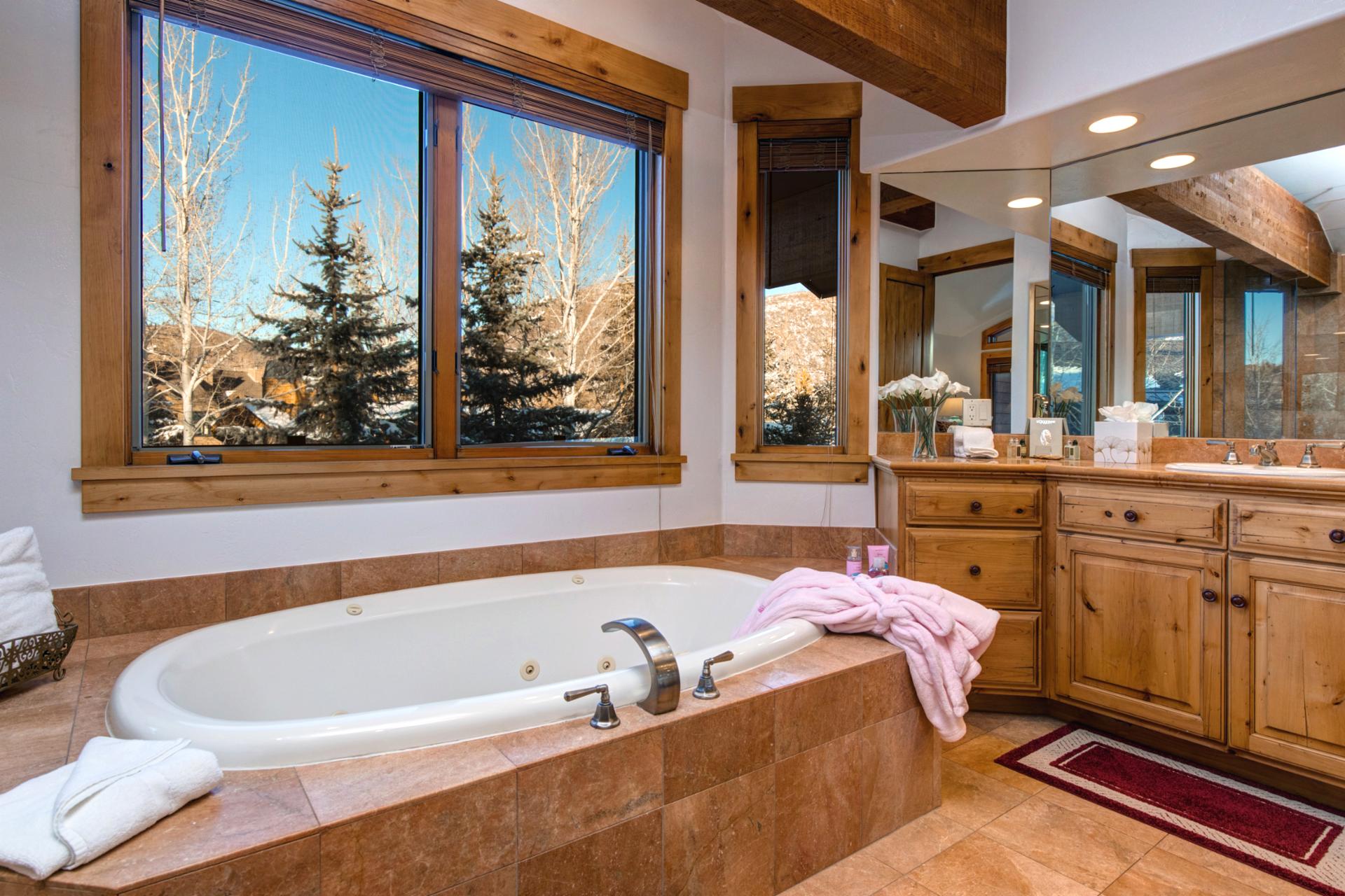 Soaking tub with windows to watch the snow fall or wake up to the morning sunshine