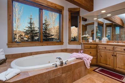Soaking tub with windows to watch the snow fall or wake up to the morning sunshine