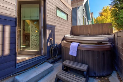 Private hot tub at Luxury Private Home PEA-1009 — soak beneath the fall foliage just steps from your Old Town Park City door PEA-1009