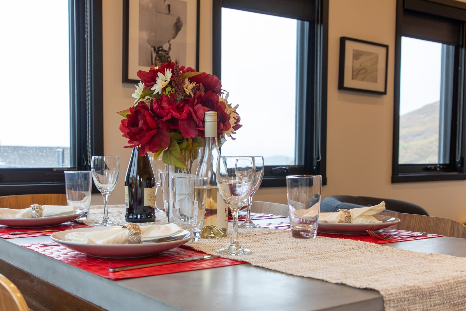 Fresh florals and bright windows elevate the dining experience with natural warmth.