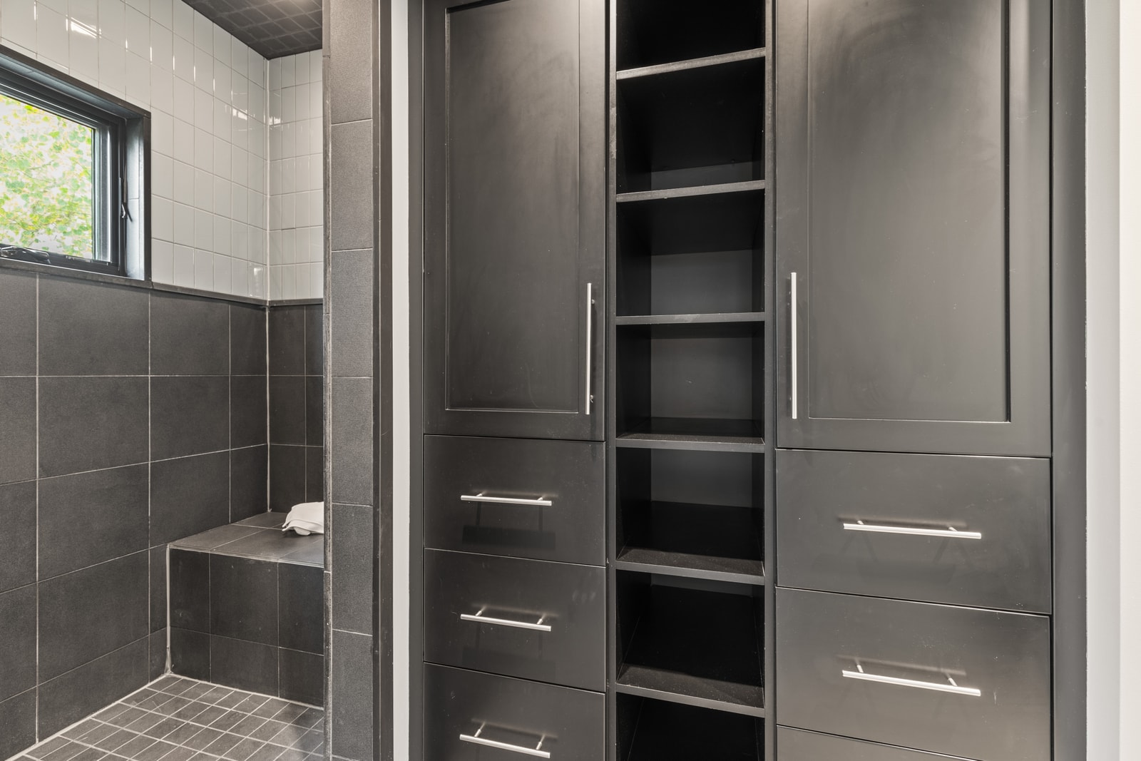 Additional view of guest bath shows sleek built-ins and hotel-style finishes.