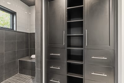 Additional view of guest bath shows sleek built-ins and hotel-style finishes.