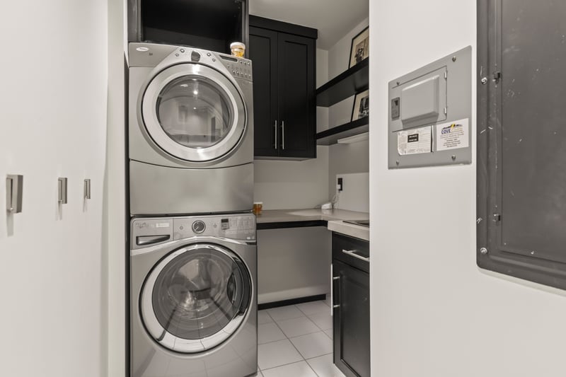 Washer and dryer are conveniently located and tucked away near sleeping quarters. PEA-1114